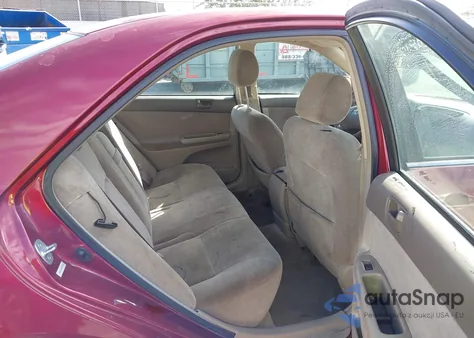 2003 Toyota Camry Le z USA, uszkodzony, nr VIN JTDBE32K430171722